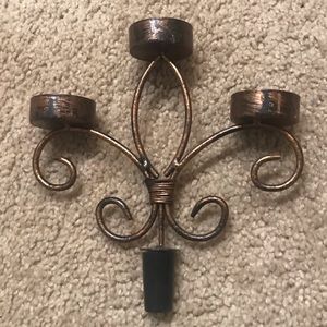 Wine bottle topping tea light holder